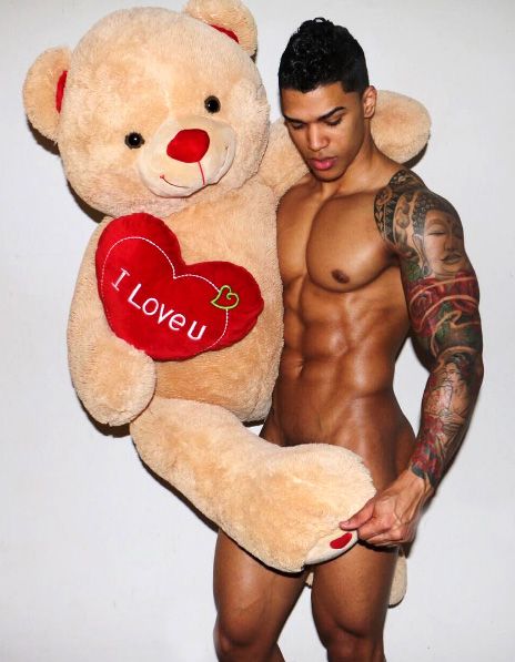 Hot man and stuffed bear.